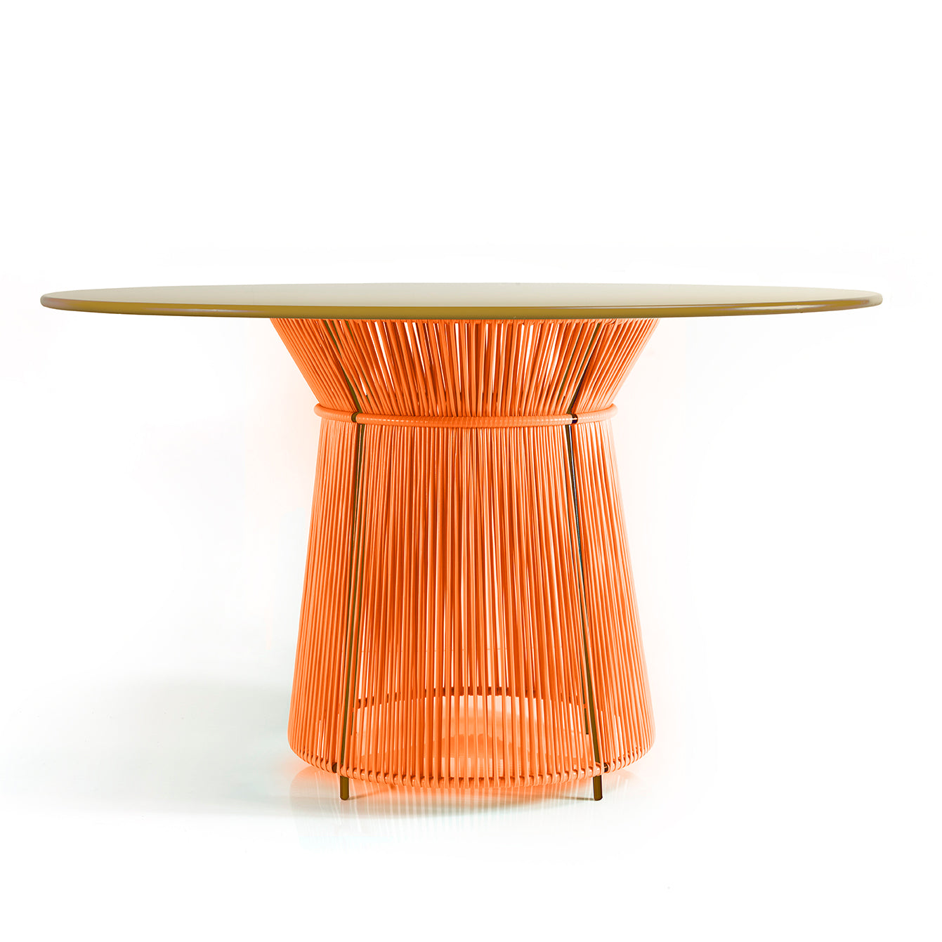 The Caribe Dining Table by Ames features a smooth, round top and an orange base with a rope pattern, crafted from tightly woven strings using the momposino weaving technique. It stands on a white surface against a plain backdrop, capturing Caribbean-inspired design.