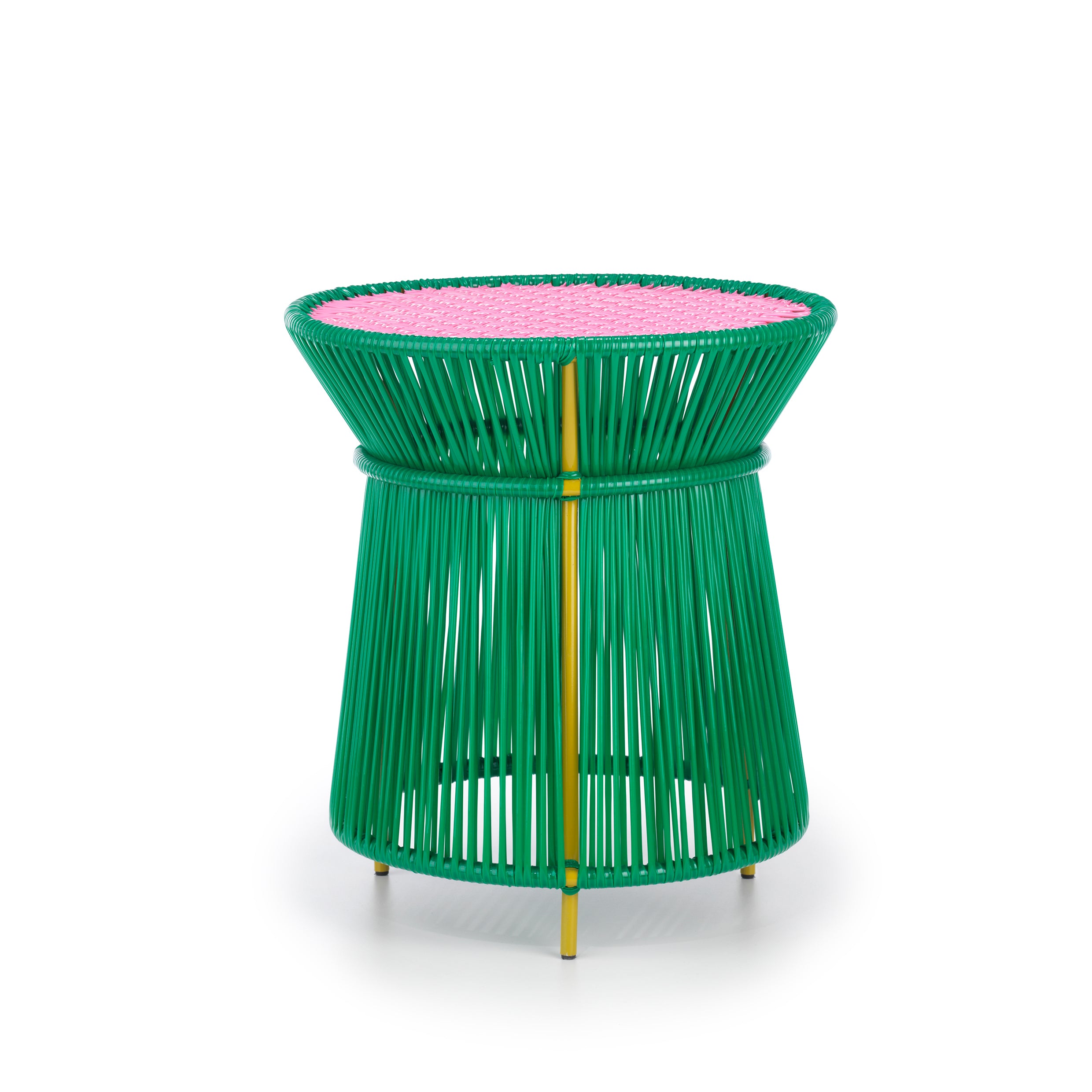 The Ames Caribe High Table by Ames, designed by Sebastian Herkner, features a modern round shape with a green base of vertical rods and a flat pink woven top with yellow details—perfect as colorful, contemporary outdoor furniture.