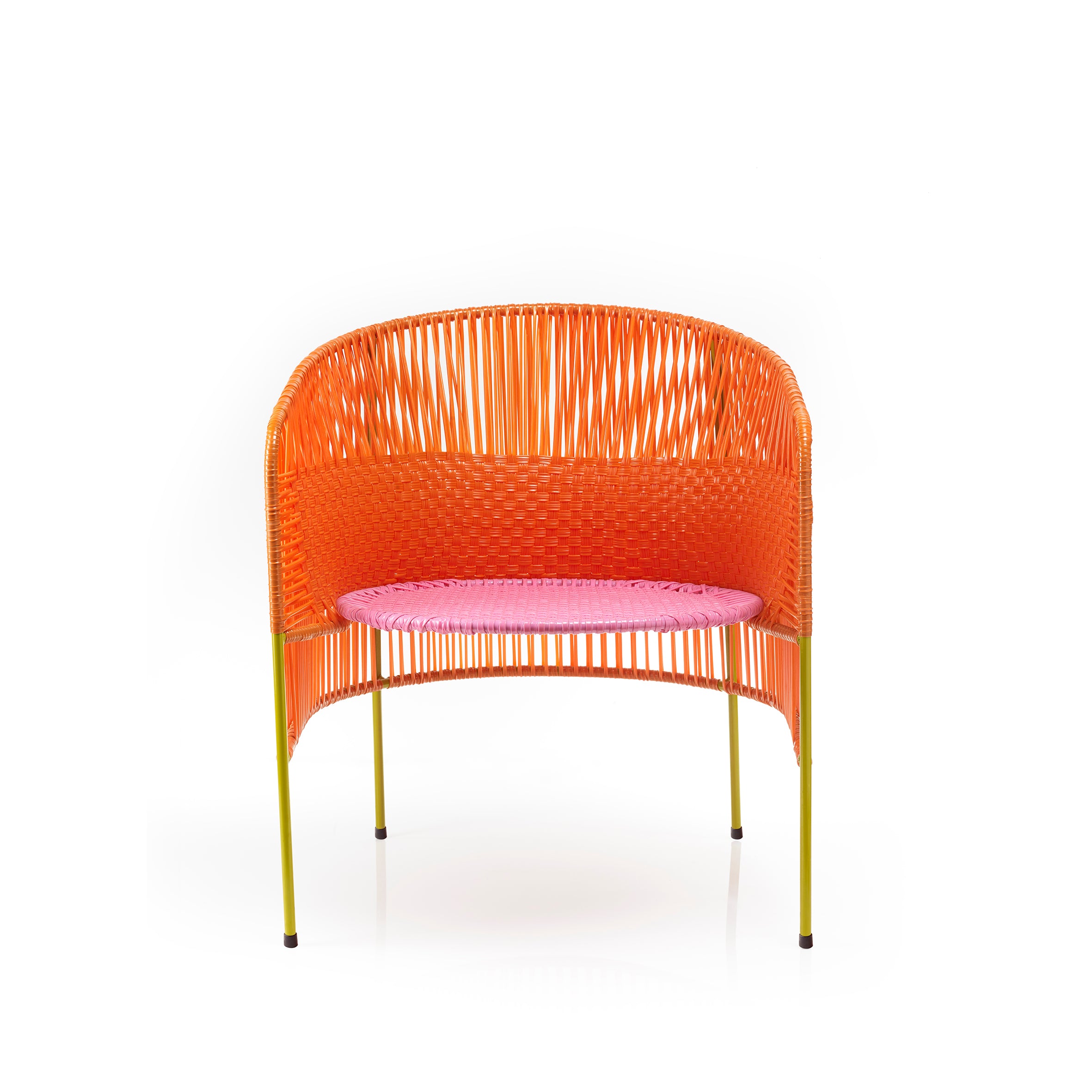 The Caribe Lounge Chair by Ames features a modern design with a vibrant orange woven backrest and a pink woven seat. It has thin yellow metal legs, inspired by Caribbean coast colors, and is perfect for outdoor use against a plain white background.