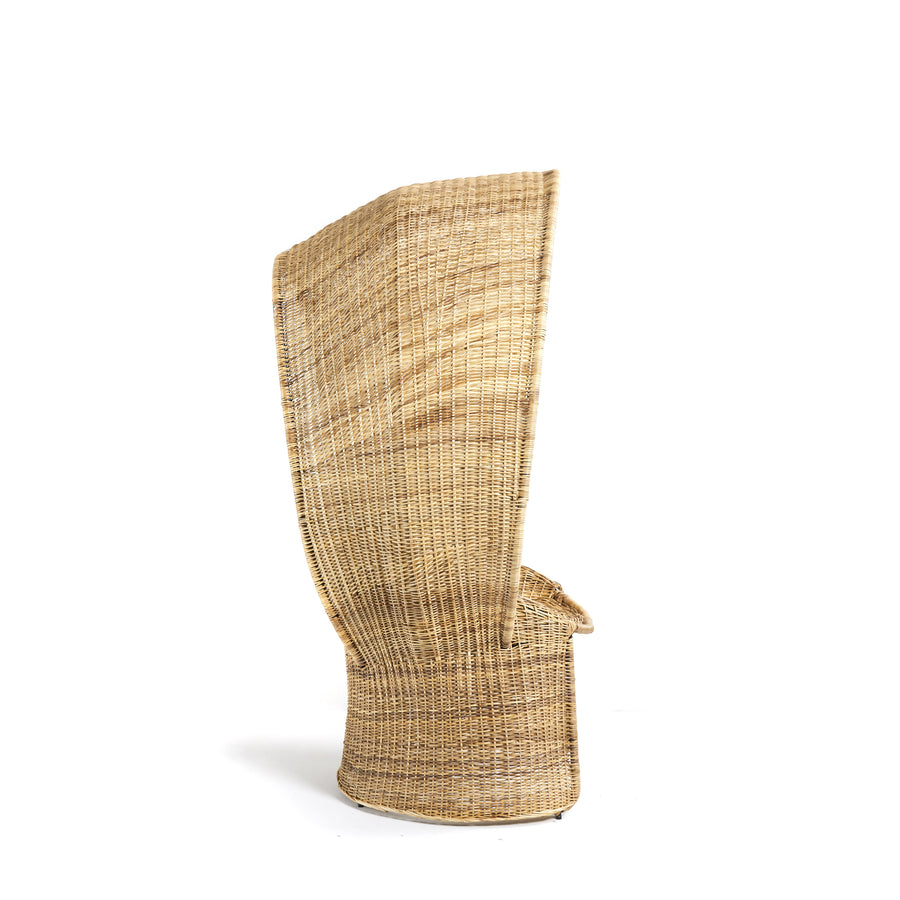 The Ames Cartagenas Natural Reina Chair by Ames features a tall, uniquely shaped wicker design with a high curved backrest and rounded base, photographed against a white background.