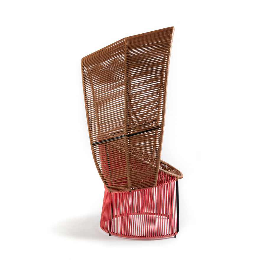From the Cartagenas collection by Ames, the Reina Cocoon Chair has a high backrest of woven brown and red wicker, round base, and mixed flat/cylindrical shapes, making it a modern addition to outdoor spaces.