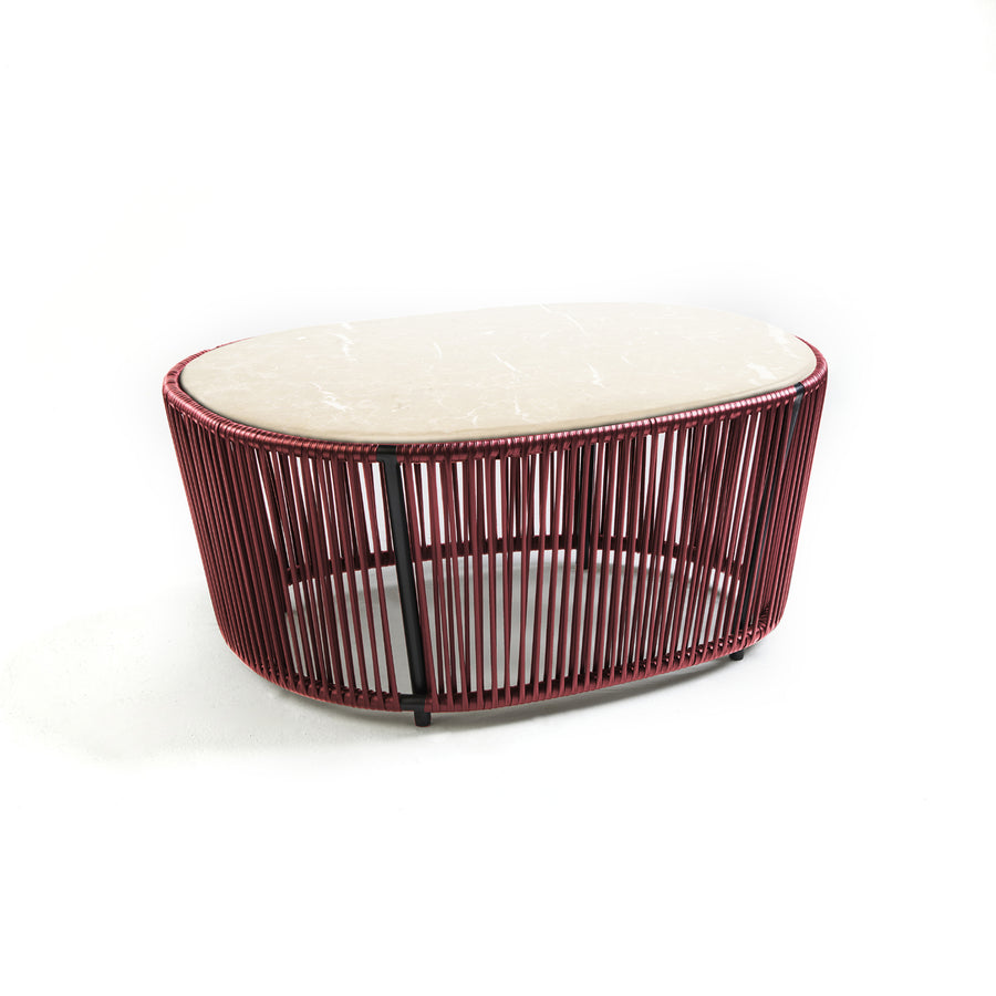The Ames Cartagenas Coffee Table by Ames features a light marble top and a circular base of vertical red metal rods, designed by Sebastian Herkner, shown against a plain white background.