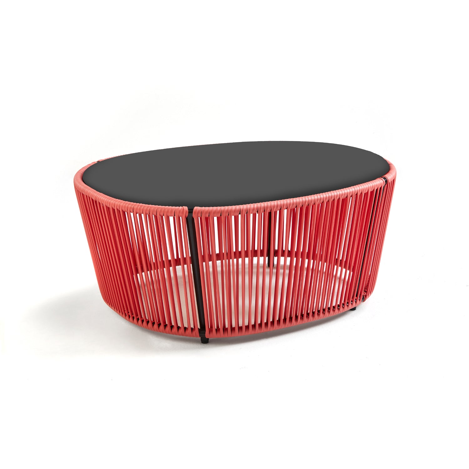 The Ames Cartagenas Coffee Table by Ames has a black oval top and a red open-frame base of vertical rods, designed by Sebastian Herkner, shown against a white background.
