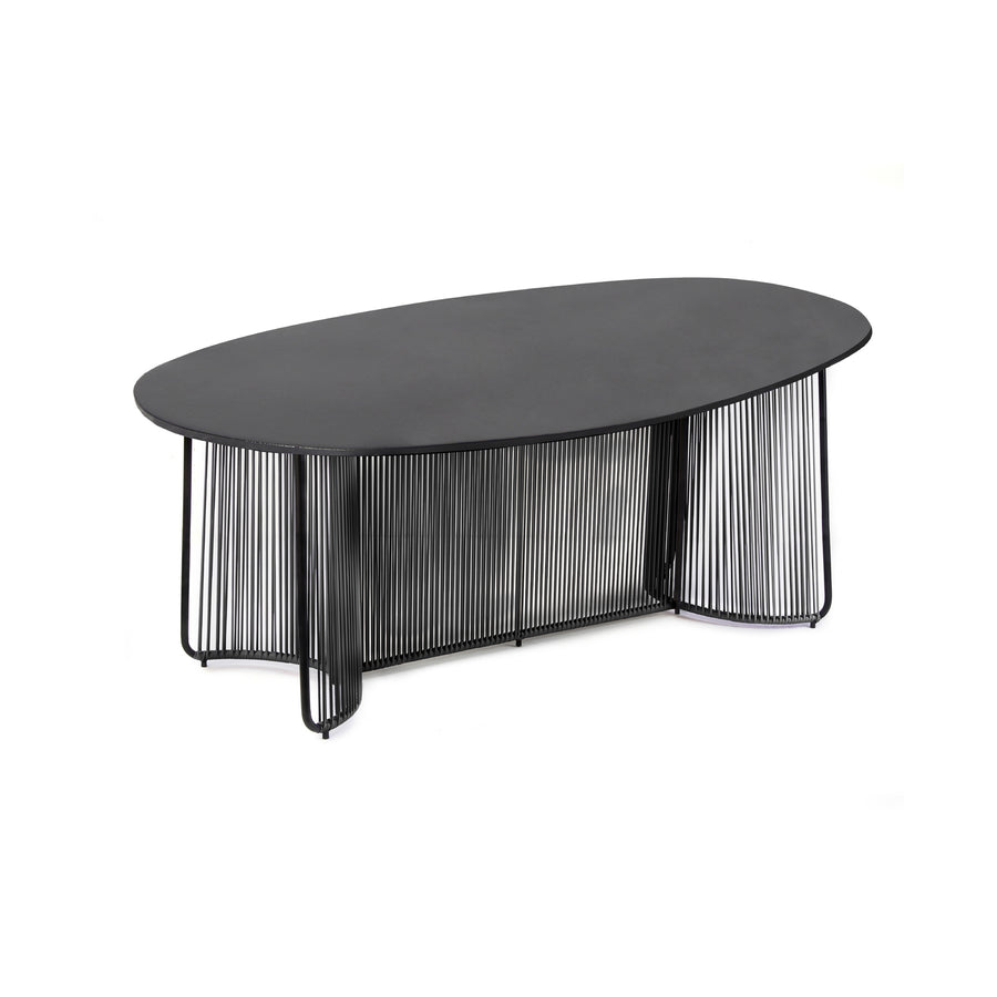 The Ames Cartagenas Dining Table by Ames features a modern oval design with a marble tabletop and a base of curved vertical metal rods, echoing Sebastian Herkner’s signature style.