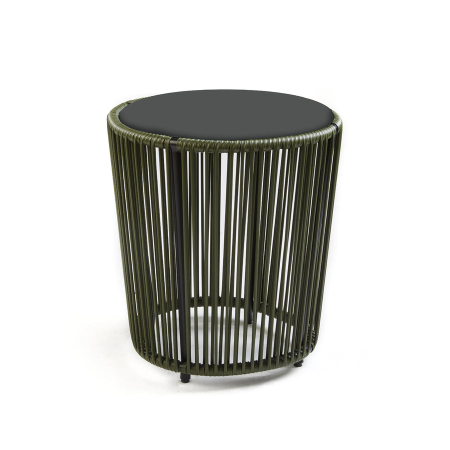 The Cartagenas Sidetable by Ames, designed by Sebastian Herkner, features a black top and an olive green, slatted cylindrical base with evenly spaced vertical rods for an airy and modern look inspired by a lively coastal metropolis.