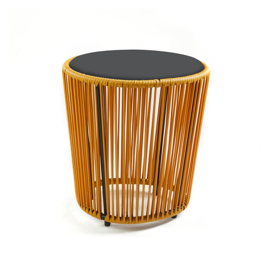 The Cartagenas Sidetable by Ames features a black top and an open cylindrical base made of orange wooden slats. Designed by Sebastian Herkner, it boasts a modern, minimalist aesthetic that infuses any space with the vibrant charm of a lively coastal metropolis.
