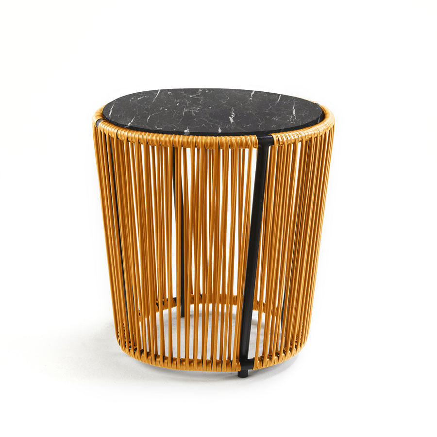 The Cartagenas Sidetable by Ames, inspired by a vibrant coastal city, showcases a compact round design with a black marble top and a base of vertical golden rods on a clean white background.