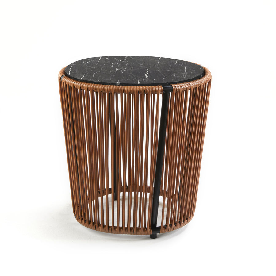 The Cartagenas Sidetable by Ames, crafted by Sebastian Herkner, features a black marble top on a cylindrical base with vertical brown wooden slats, reflecting its lively coastal city inspiration through its modern and minimalist design.