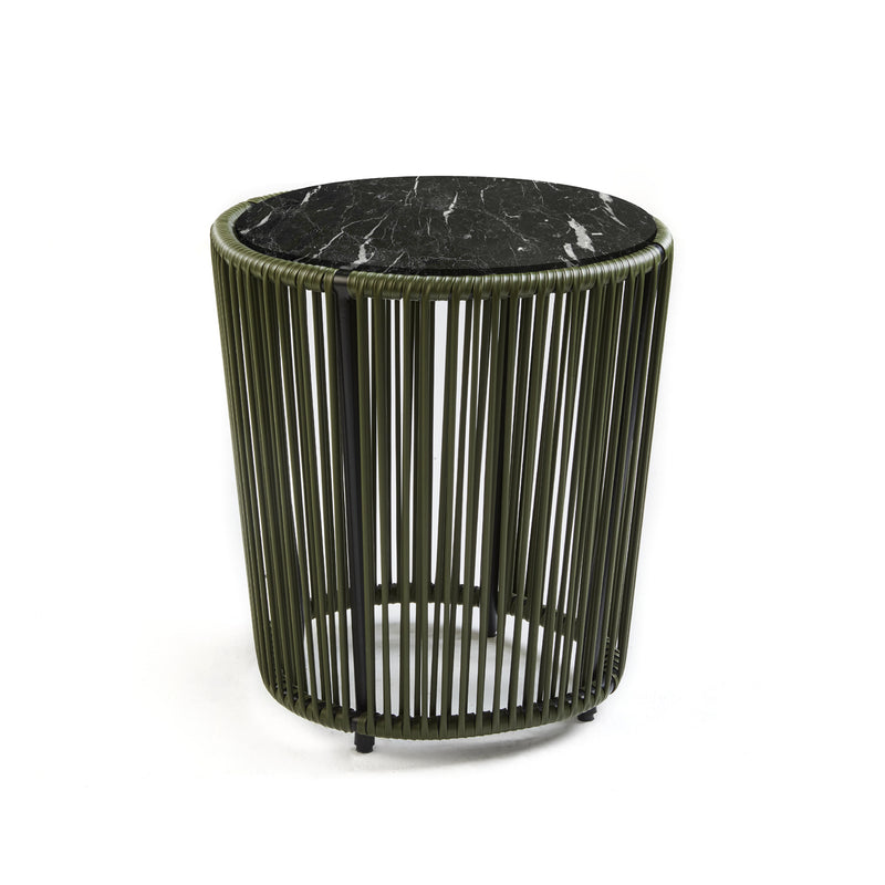 The Cartagenas Sidetable by Ames features a black marble top and a cylindrical base of vertical green metal bars, embodying a modern, minimalist design. Inspired by the vibrant coastal city, this piece reflects Sebastian Herkners visionary style against a simple white backdrop.