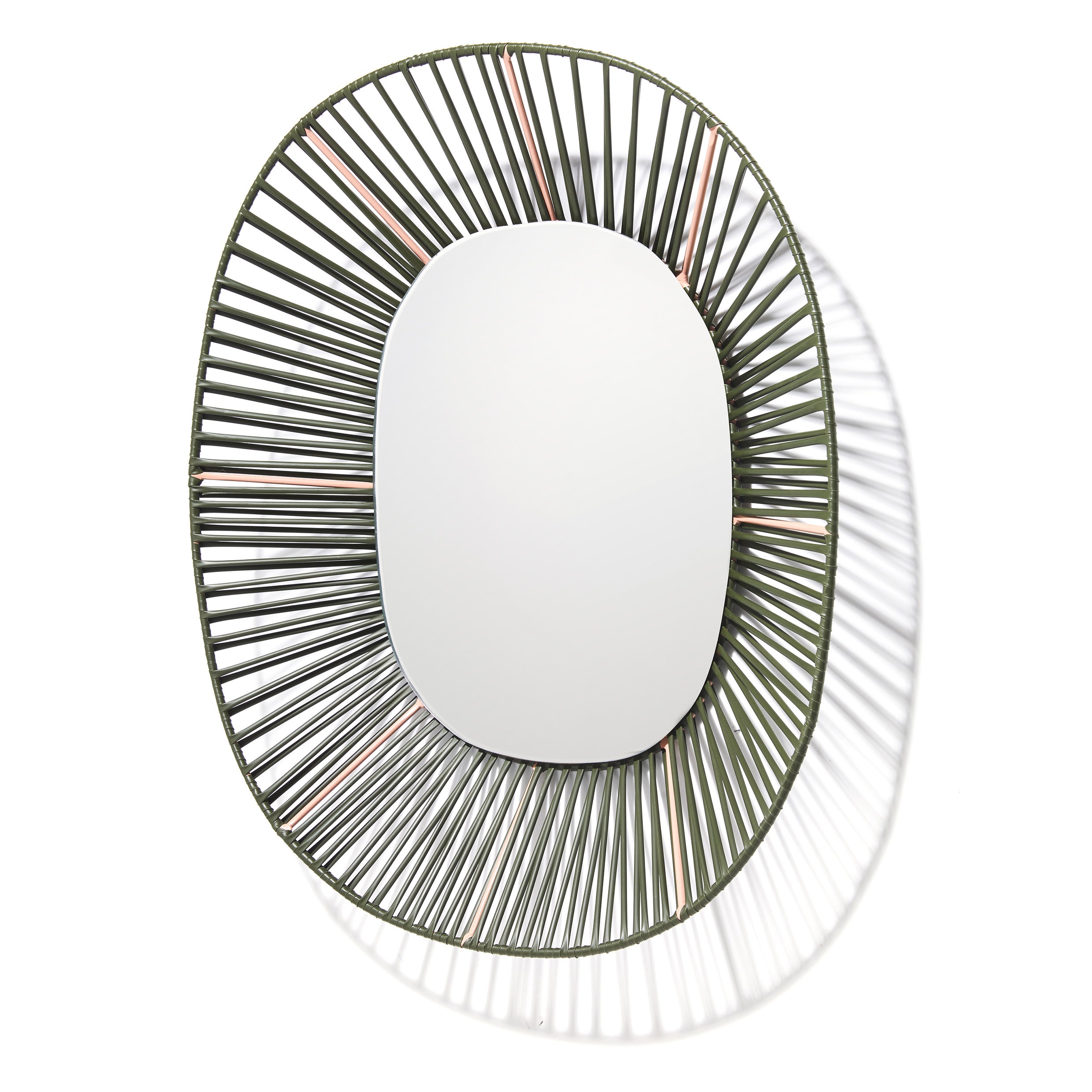 The Cesta Mirror by Ames is an oval wall mirror with a distinctive wire frame that forms a detailed sunburst pattern. Evenly spaced metal wires cast intricate shadows on a white background, enhancing its artistic flair and making it a standout piece with vibrant color combinations.