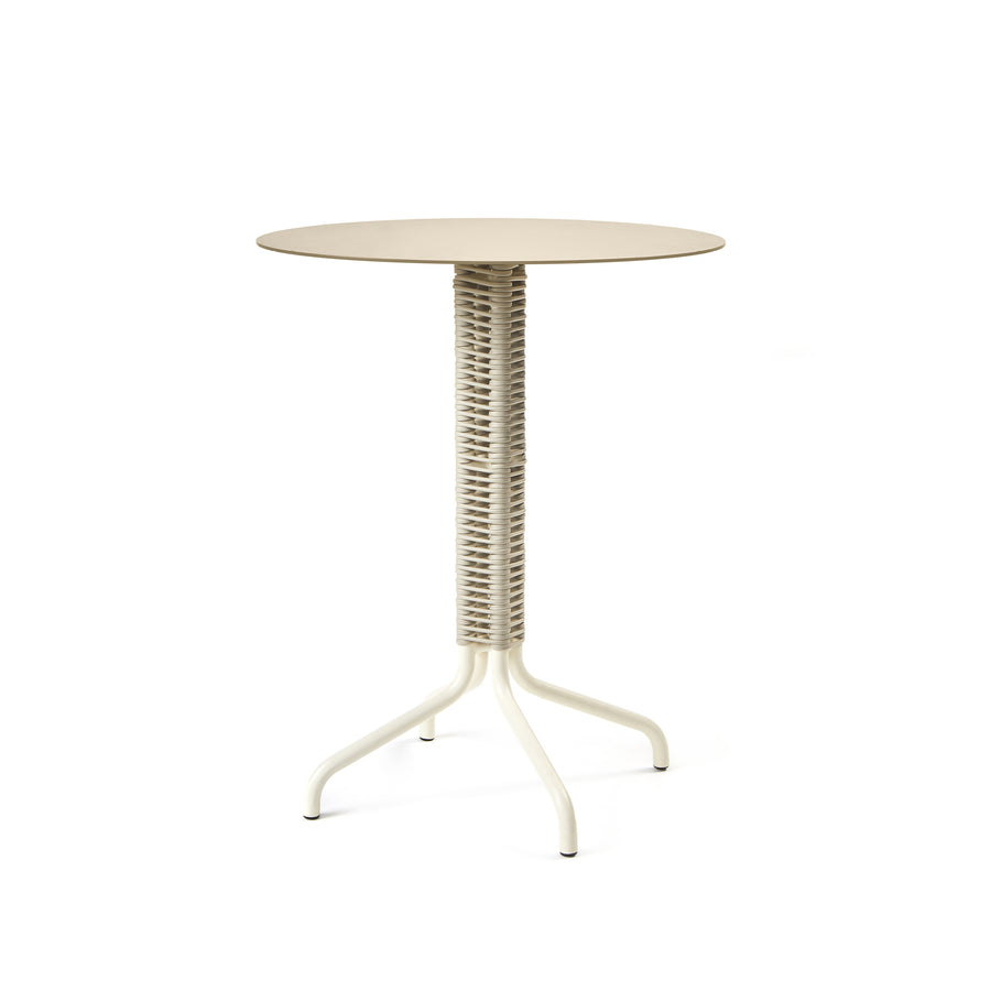 The Ames Cielo Bistro Table, designed by Sebastian Herkner, is a modern beige round table with a minimalist aesthetic. It features a woven textured central column and three sturdy curved legs, showcasing a sleek and compact design.