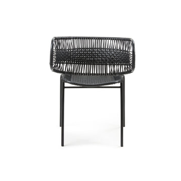 Introducing the Cielo Armchair by Ames—a versatile outdoor chair featuring a minimalist design with traditional black weaving on a simple metal frame. Photographed against a plain white background, it exudes timeless elegance.