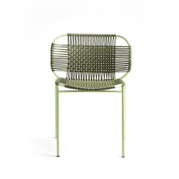 The Ames Cielo Chair by Ames is a green metal outdoor dining chair with a woven backrest and seat, featuring thin legs and a minimalist, airy design. This stackable chair is shown against a plain white background.