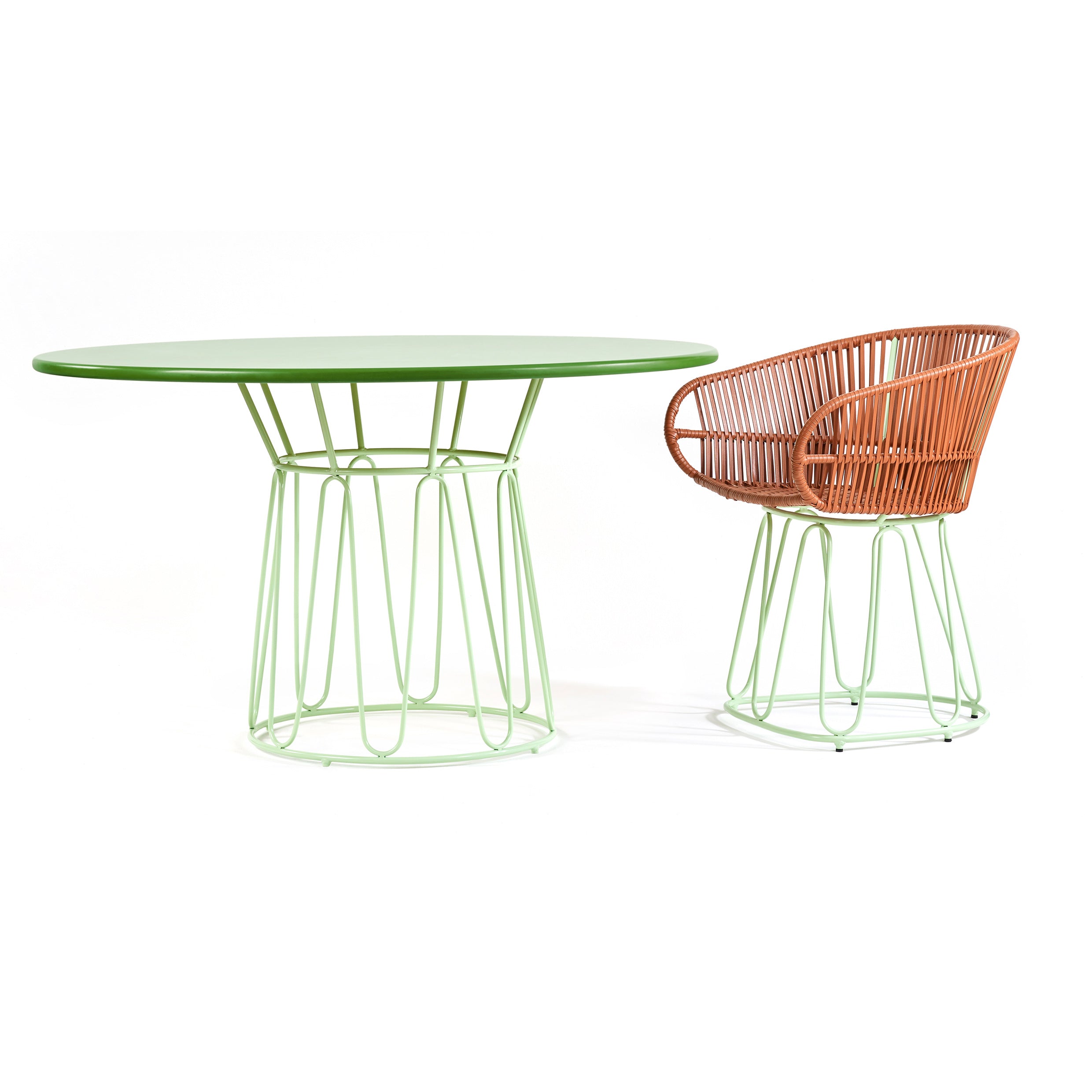 The Ames Circo Dining Table by Ames features a round green top and wireframe base, paired with a matching chair with green wireframe base and brown leather cord-woven seat and back, displayed on a white background.