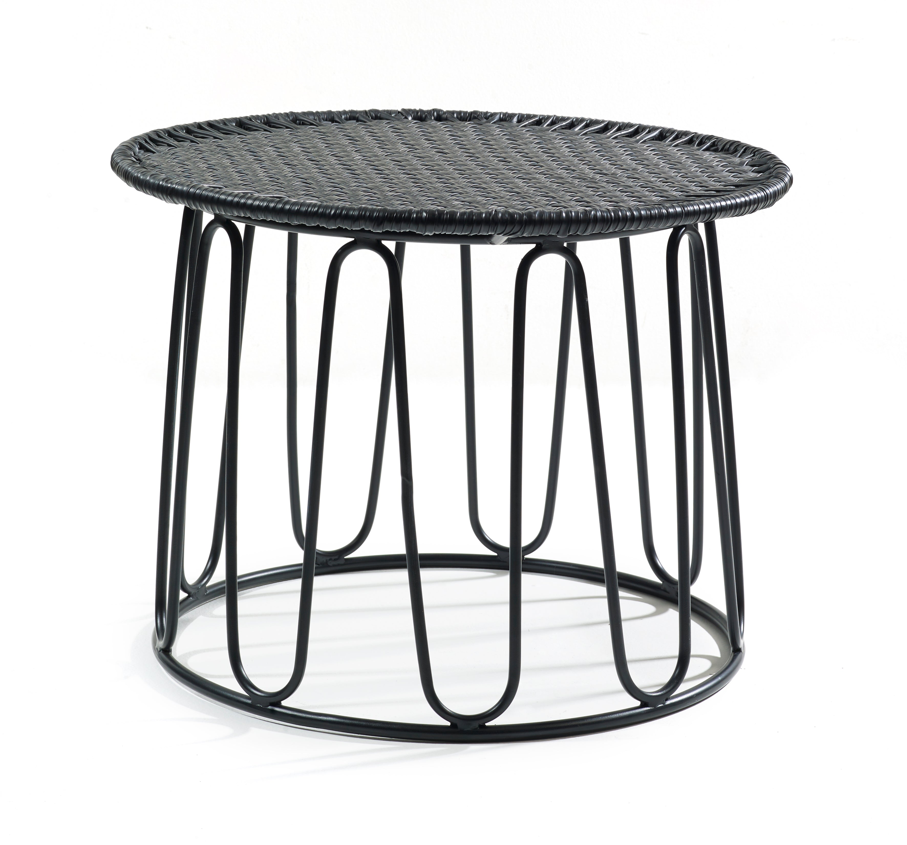 The Ames Circo Side Table by Ames, designed by Sebastian Herkner, features a round black woven top and an open geometric metal base with curved vertical supports.