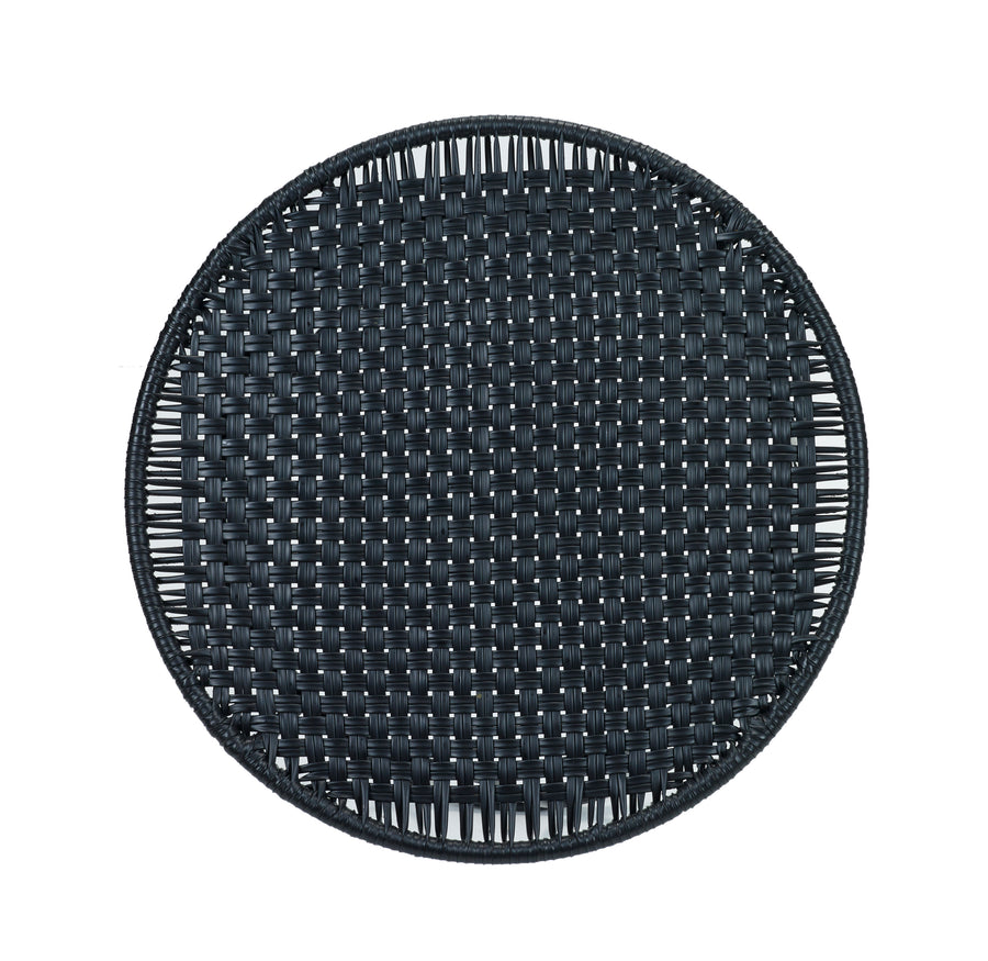 The Ames Circo Side Table by Ames features a round, black woven top with a tight interlaced pattern, inspired by handcrafted Colombian furniture, shown from above on a white background.
