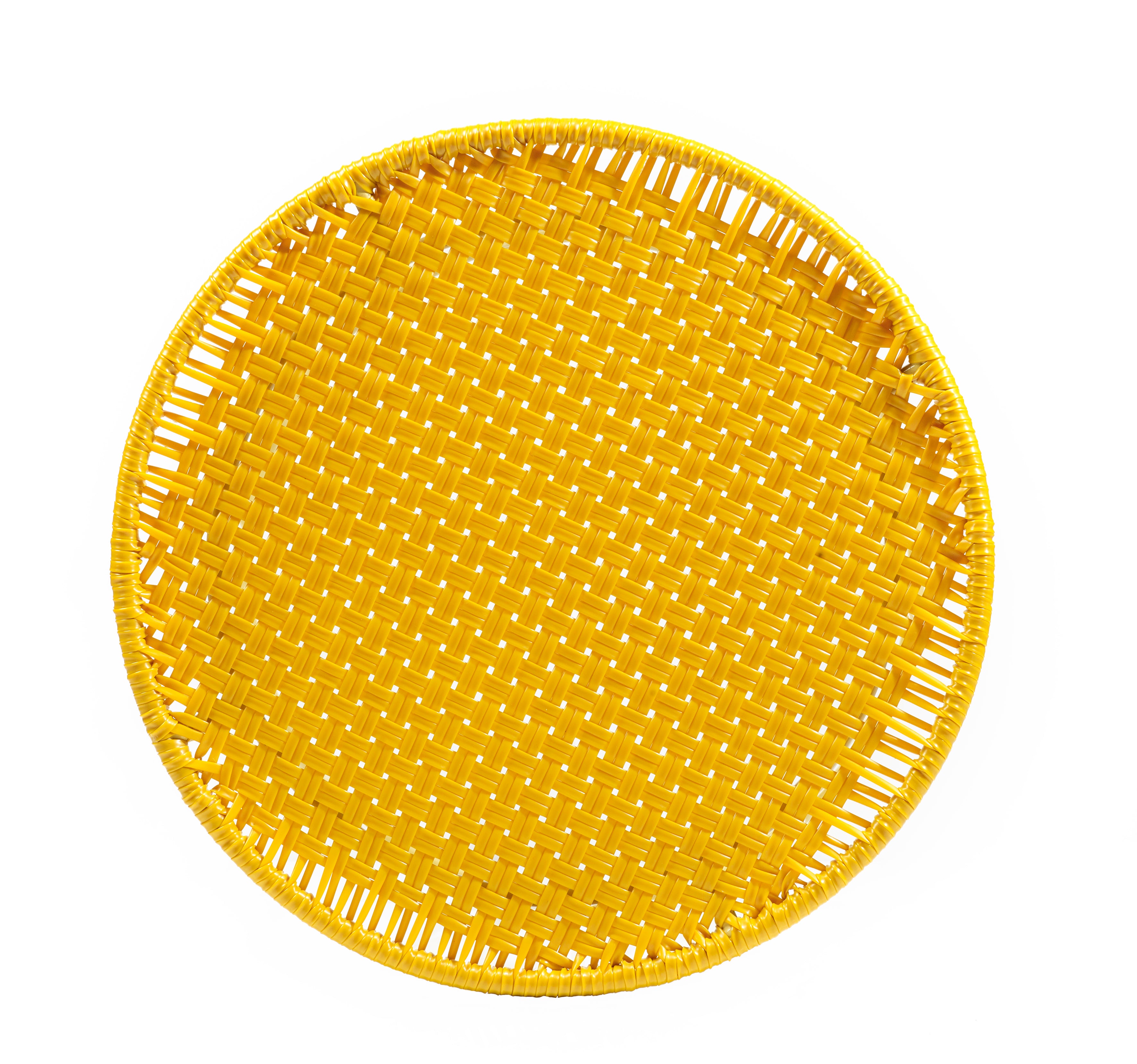 The Ames Circo Side Table by Ames, handcrafted in Colombia, features a round yellow woven design with an open lattice pattern, shown from above on a white background.
