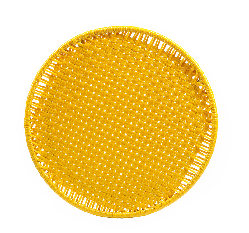 The Ames Circo Side Table by Ames, handcrafted in Colombia, features a round yellow woven design with an open lattice pattern, shown from above on a white background.