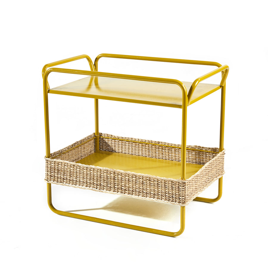 Yellow two-tier cart featuring a top shelf and lower woven basket of recycled plastic. Rounded metal handles and frame showcase modern design, perfectly complementing the Ames Dichas Sidetable style.