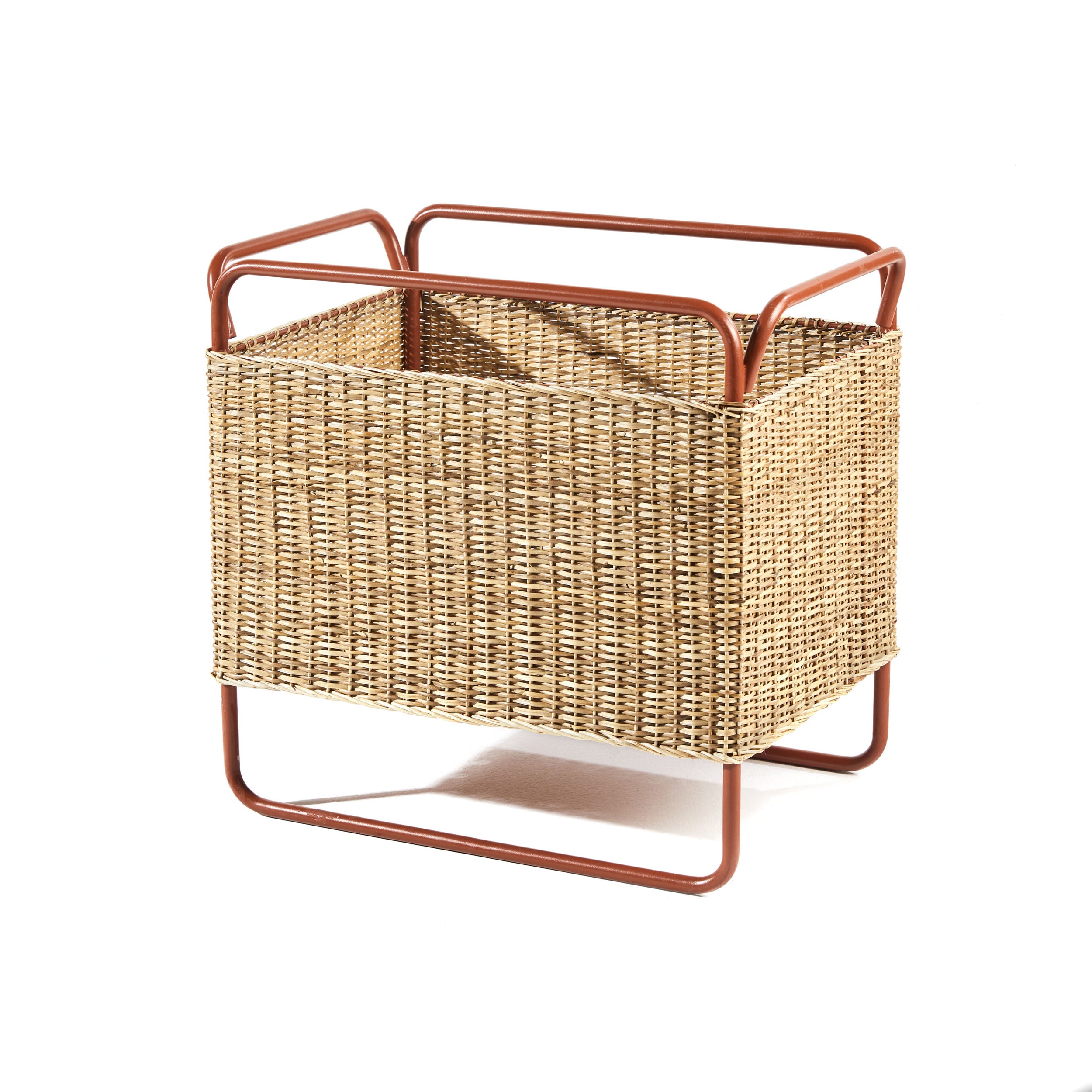 The Ames Dichas Natural Basket 1 by Ames is a rectangular woven basket with tan wicker sides, a sturdy reddish-brown metal frame, open handles, and raised legs, shown on a white background.