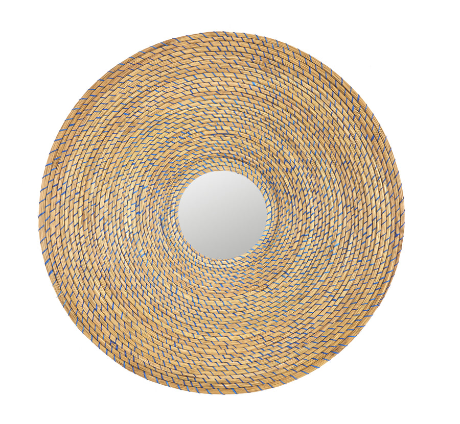 The Ames Killa Mirror by Ames is a round wall mirror with a wide, woven Iraca palm frame in a spiral pattern, shown from above against a white background.