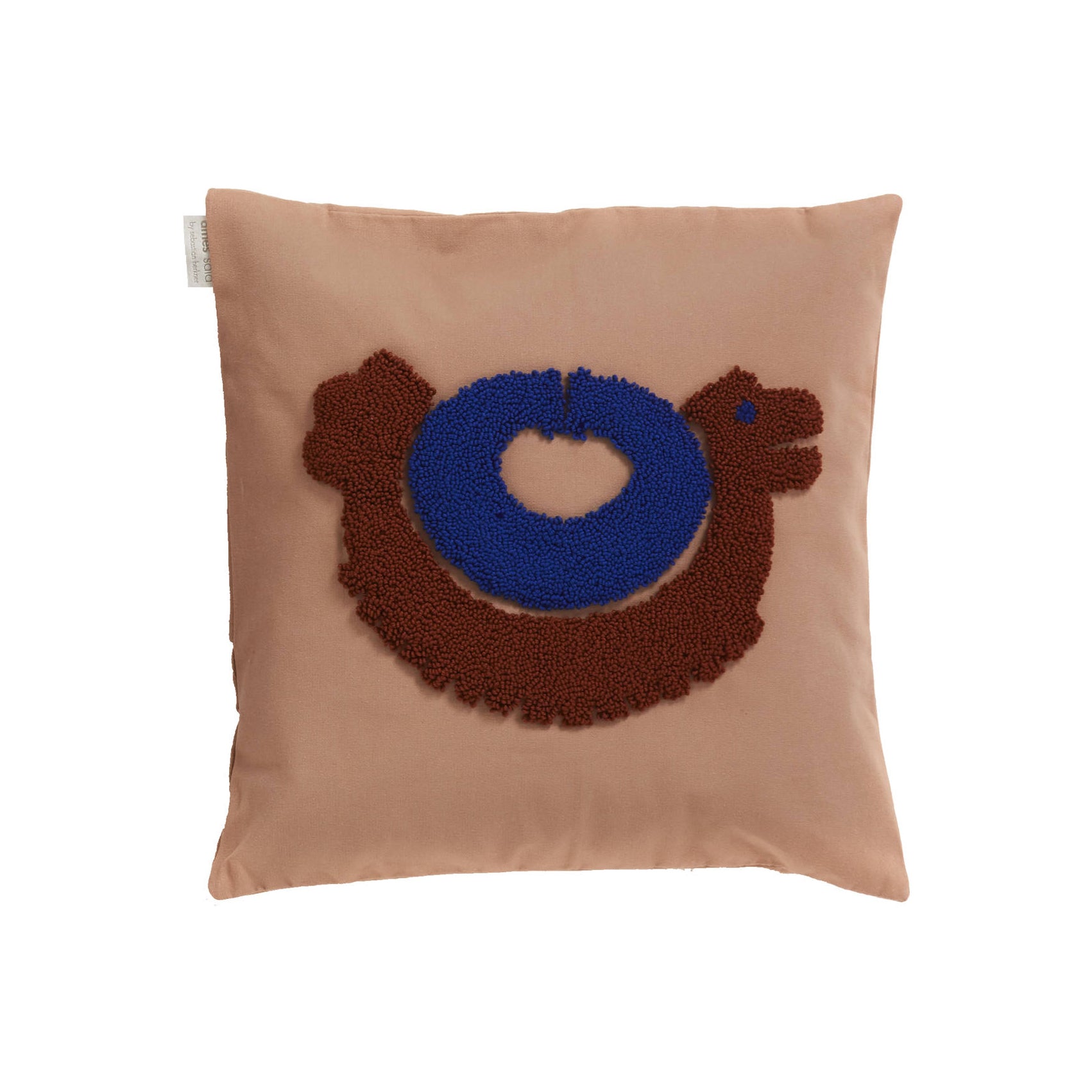 The Ames Nido Pichu cushion by Ames is a square beige pillow with an abstract embroidered brown chicken, blue circular body, and a small white heart at the center.