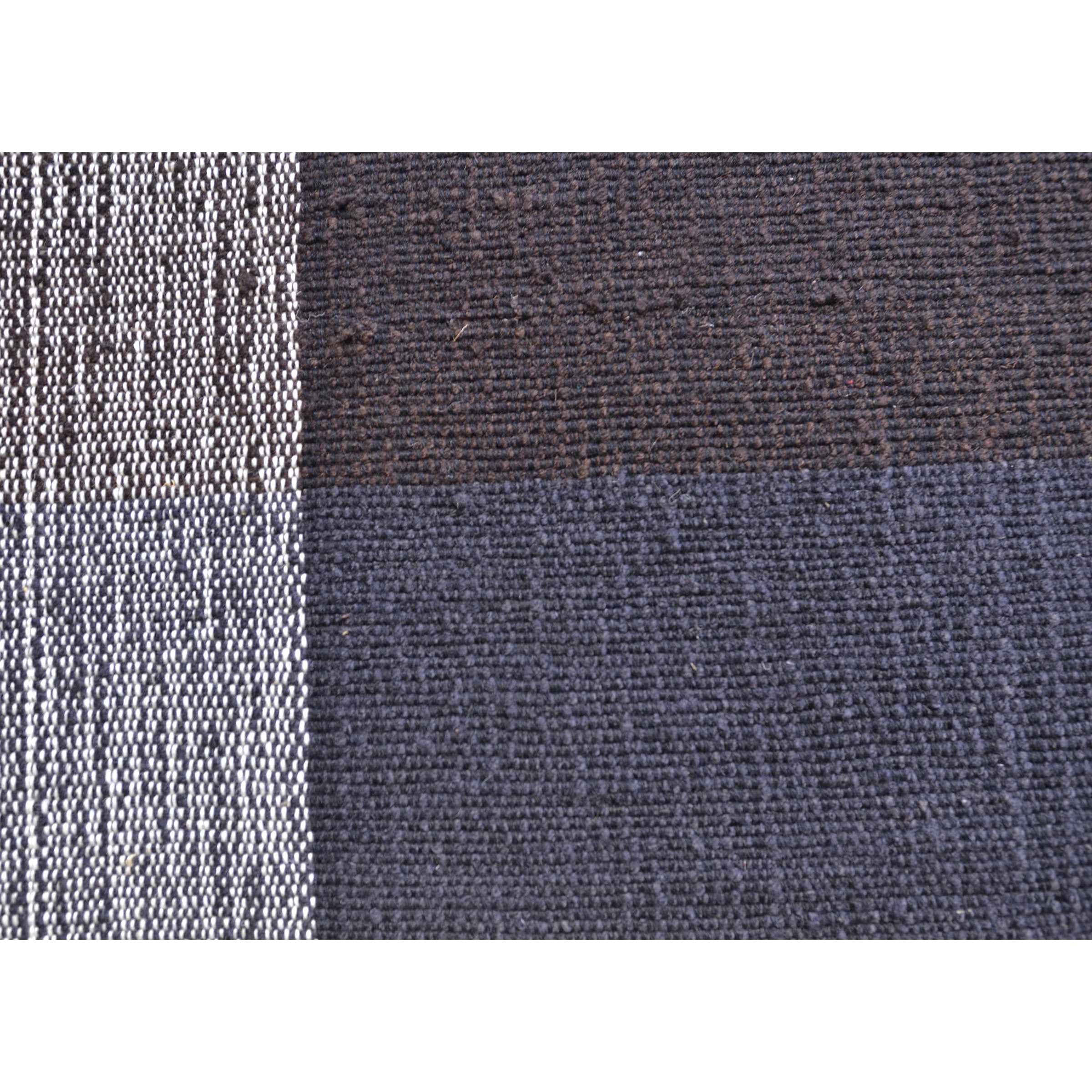 Ames Nobsa Rug features a pattern of alternating stripes: the left showcases thin, tightly woven black and white stripes reminiscent of hand-woven wool from Colombian Nobsa, while the right has wider black sections with a textured look.
