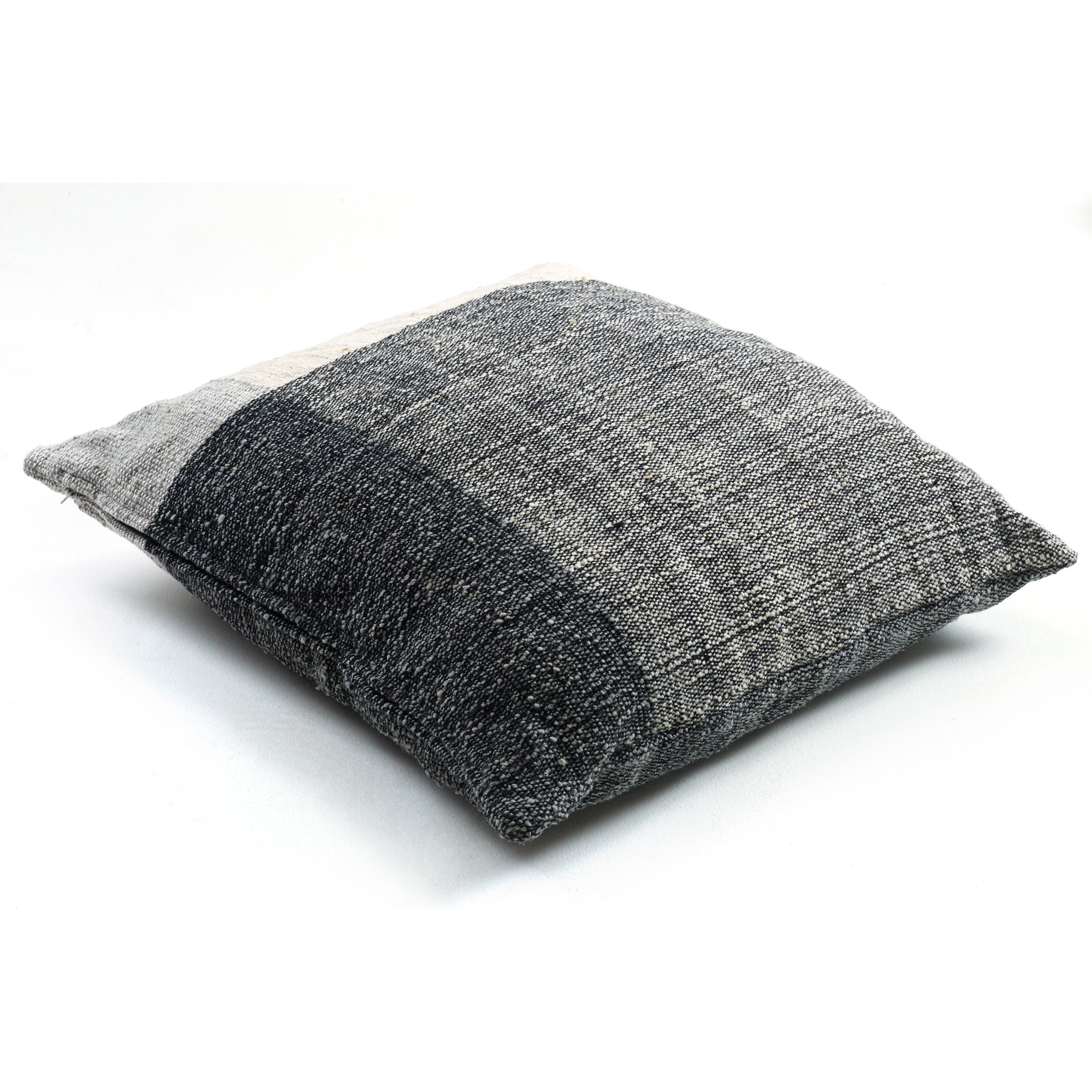 The Ames Nobsa Cushion by Ames is a square throw pillow, hand-woven from wool in gray tones and inspired by Nobsa pillows and Sebastian Herkner’s designs, shown on a white background.