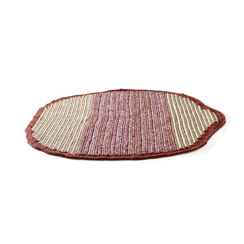 The Ames Uilas Rug by Ames is a round, flat woven wool rug featuring alternating beige and pinkish-red stripes with a solid reddish border, showcased on a white background—a stunning handmade piece.