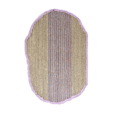 The Ames Uilas Rug by Ames is an irregular oval-shaped rug featuring vertical tan, brown, and gray stripes, bordered by a wavy pale purple edge on a white background.