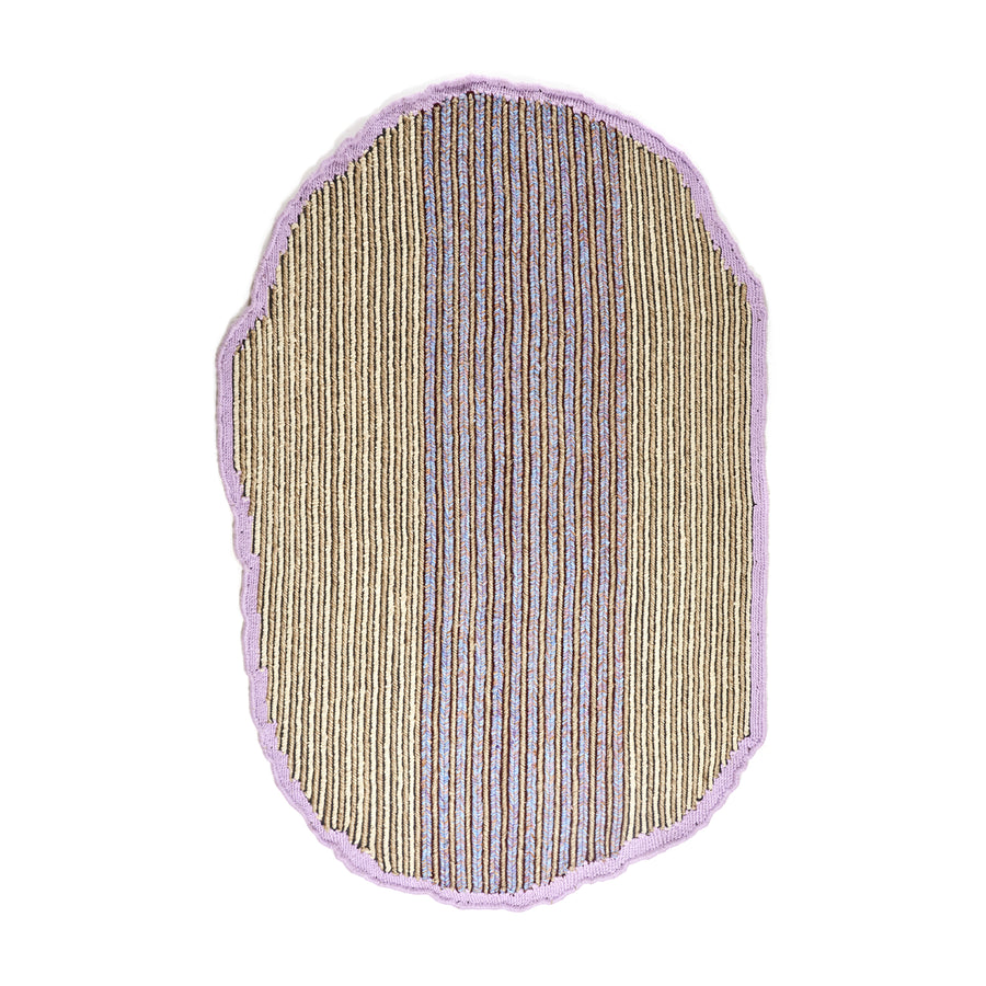 The Ames Uilas Rug by Ames is an irregular oval-shaped rug featuring vertical tan, brown, and gray stripes, bordered by a wavy pale purple edge on a white background.