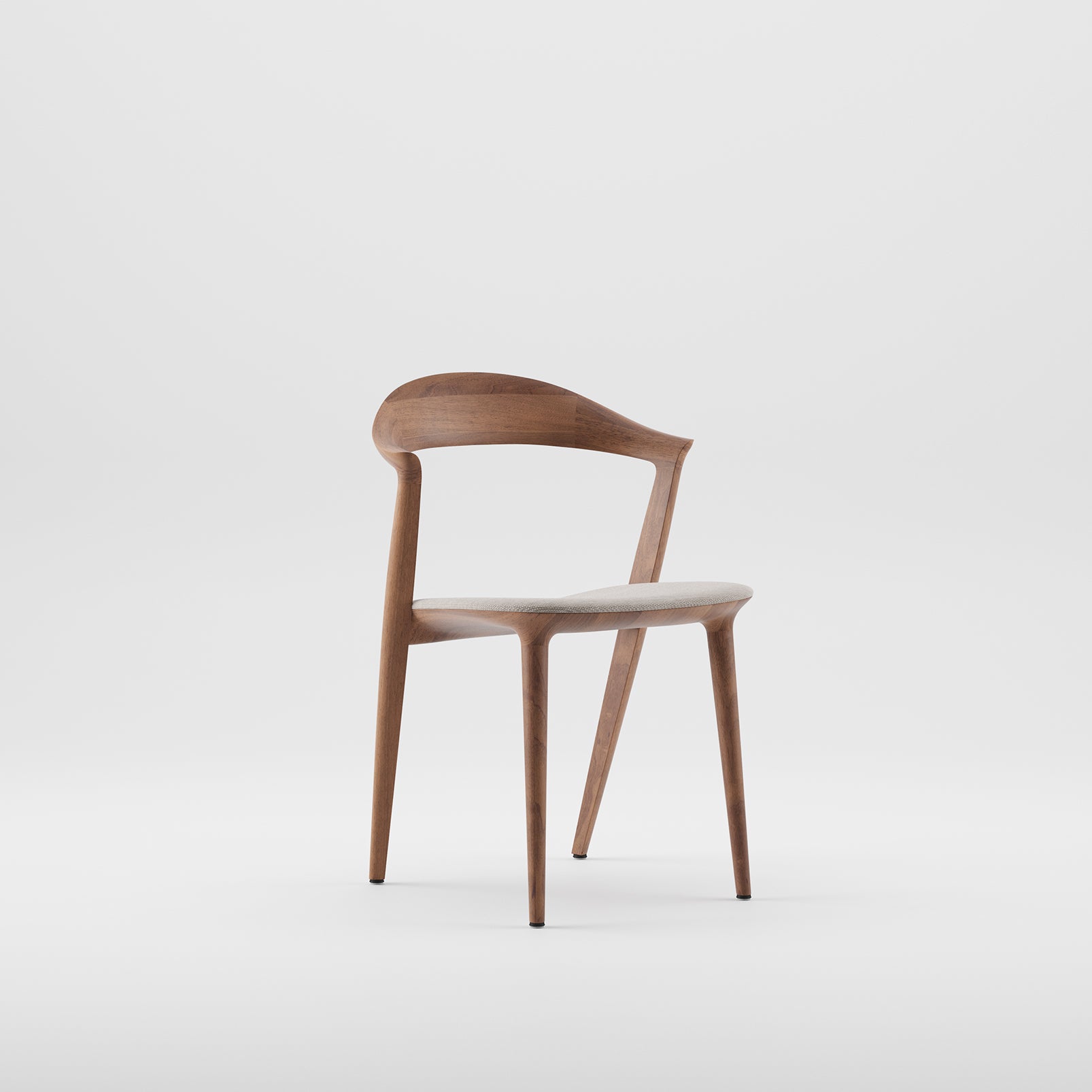 The Addo Chair by Artisan is a modern, minimalist wooden chair made from solid wood and finished with natural oils. It features a curved backrest, slender legs, and a light-colored cushioned seat elegantly displayed against a plain white background.