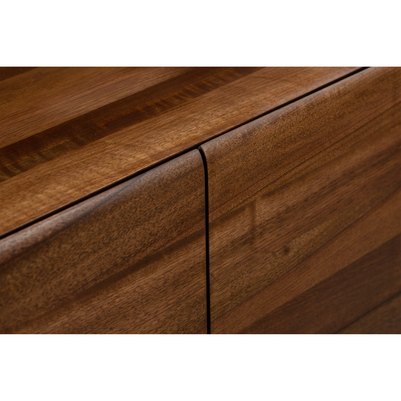 Close-up of a CLOUD High board by Artisan, crafted from solid wood. The panels feature slightly contrasting shades with visible seams at the corner, showcasing craftsmanship and natural wood variations enhanced by oils.