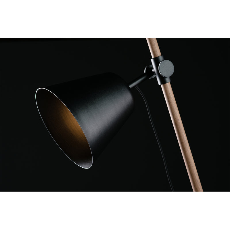 Close-up of Artisans INSERT Table Lamp, featuring a modern black conical shade and solid wood stand finished with natural oils, angled downward against a dark background.