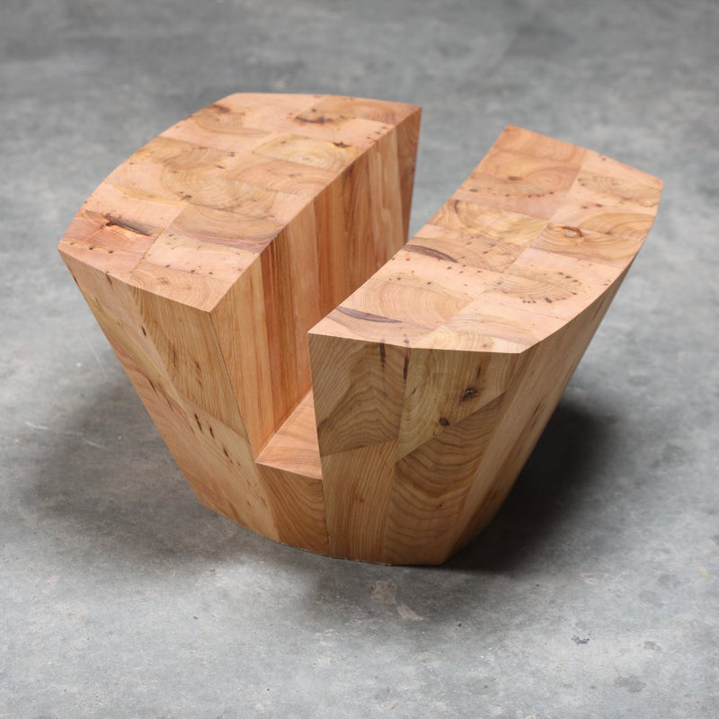 Artisans KART Coffee Table, crafted from solid wood with a geometric design, features beautiful grain and natural knots. It consists of two separate pieces on a concrete floor and is finished with eco-friendly natural oils for sustainability.