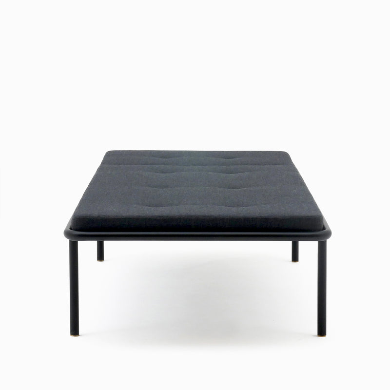 2PM Day & Night Daybed with black steel frame and gray upholstered mattress on minimalist industrial design base