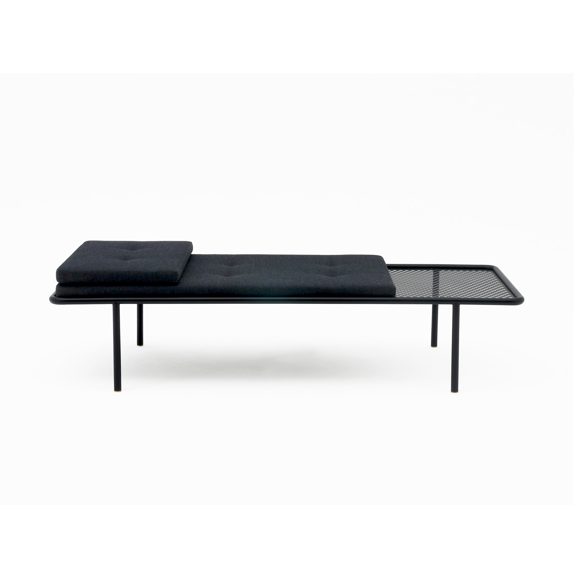 2PM Day & Night Daybed with black cushions on minimalist steel frame, featuring perforated metal side table extension
