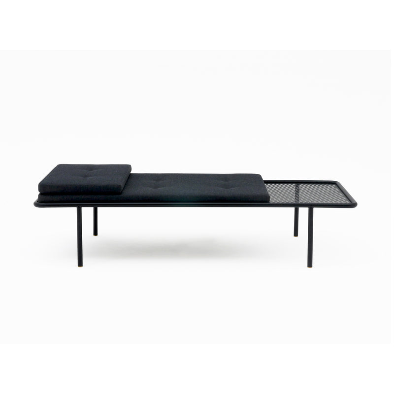 2PM Day & Night Daybed with black cushions on minimalist steel frame, featuring perforated metal side table extension