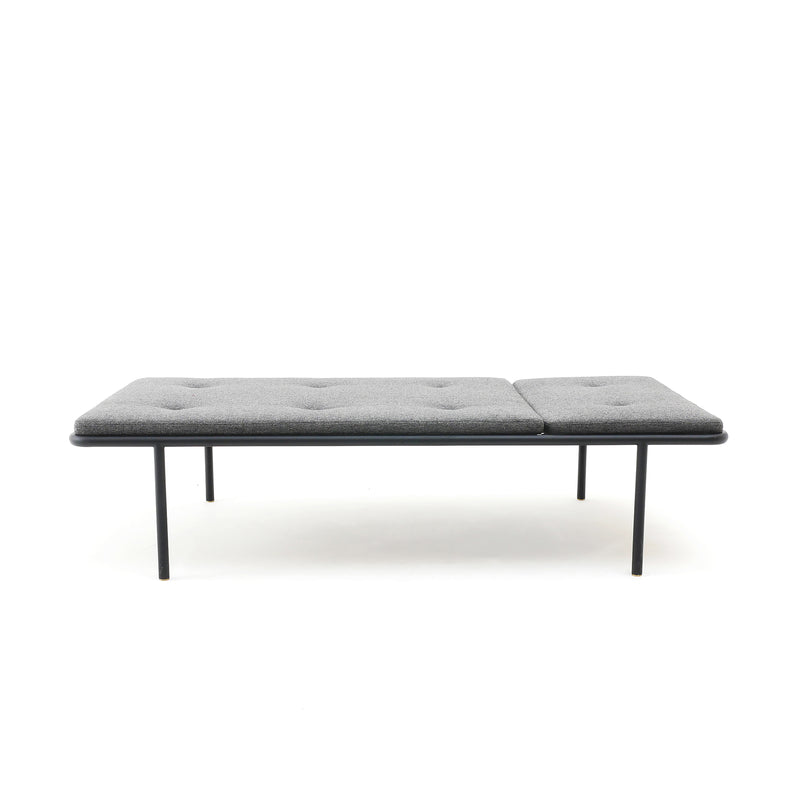 2PM Day & Night Daybed with black frame and gray tufted cushion on minimalist steel legs, modern industrial design