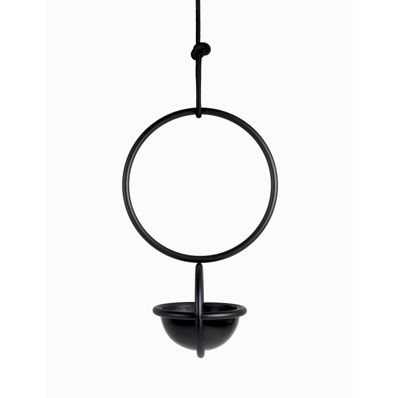 Atelier Haussmanns Blumenkugel - Hanging Flower Bowl is a black, modern hanging planter made from powder-coated steel with a minimalist design. It features a circular form with a small bowl at the bottom, elegantly suspended by a black cord against a white background.