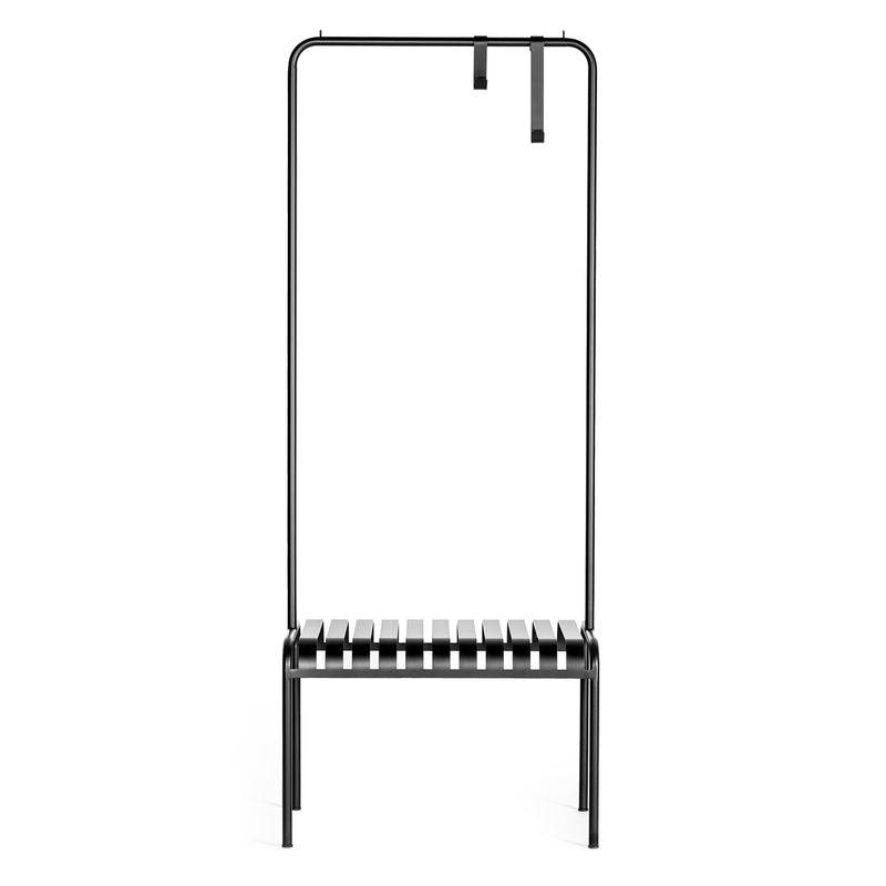 The YOUTOO by Atelier Haussmann is a minimalist black metal bench made of powder-coated steel with a backless, slatted seat. It features an overhead frame with two hanging straps for combined seating and hanging function.
