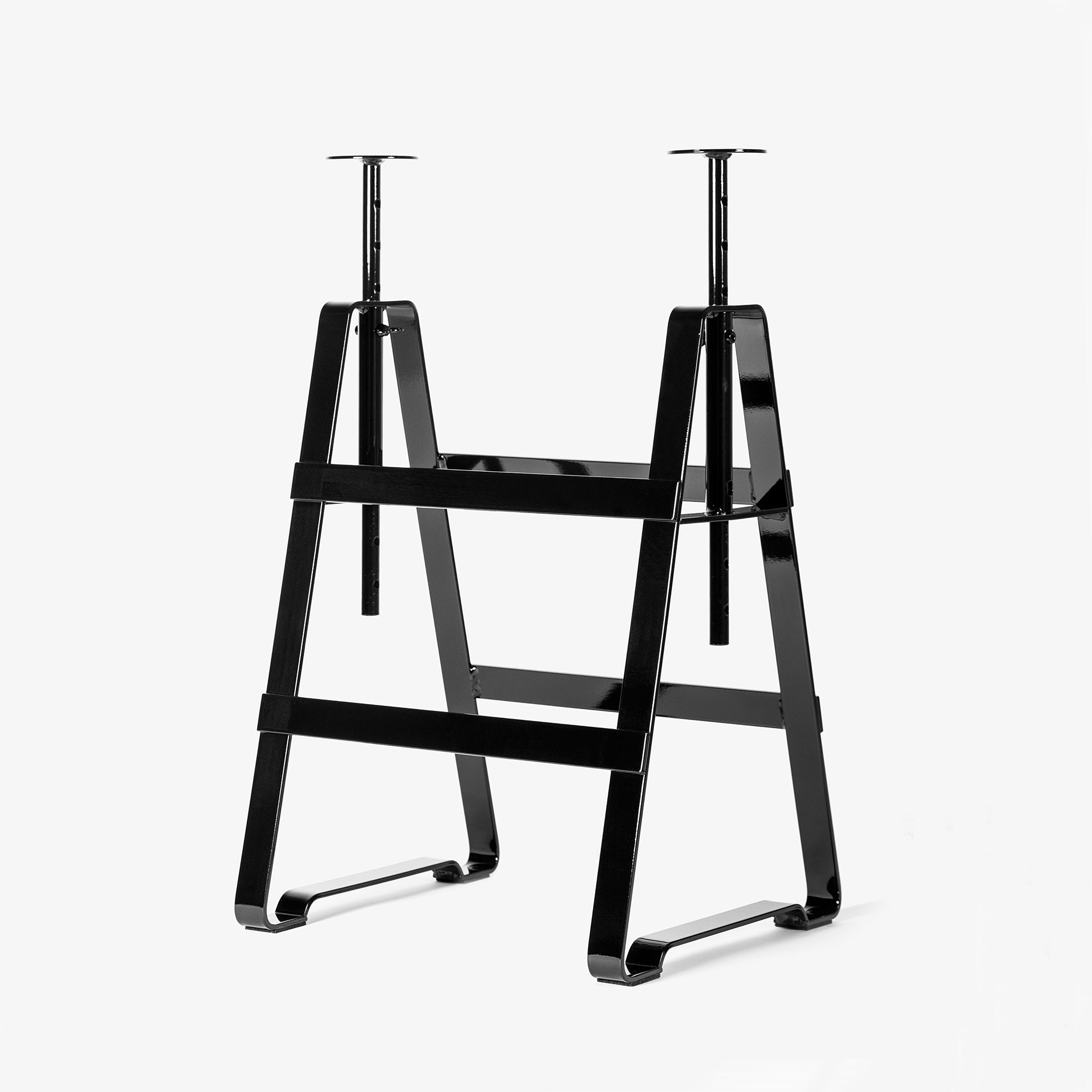 The Lackaffe Trestle by Atelier Haussmann is a black, powder-coated steel sawhorse stand with adjustable safety pins from Berlin craft producers, shown on a clean white background.