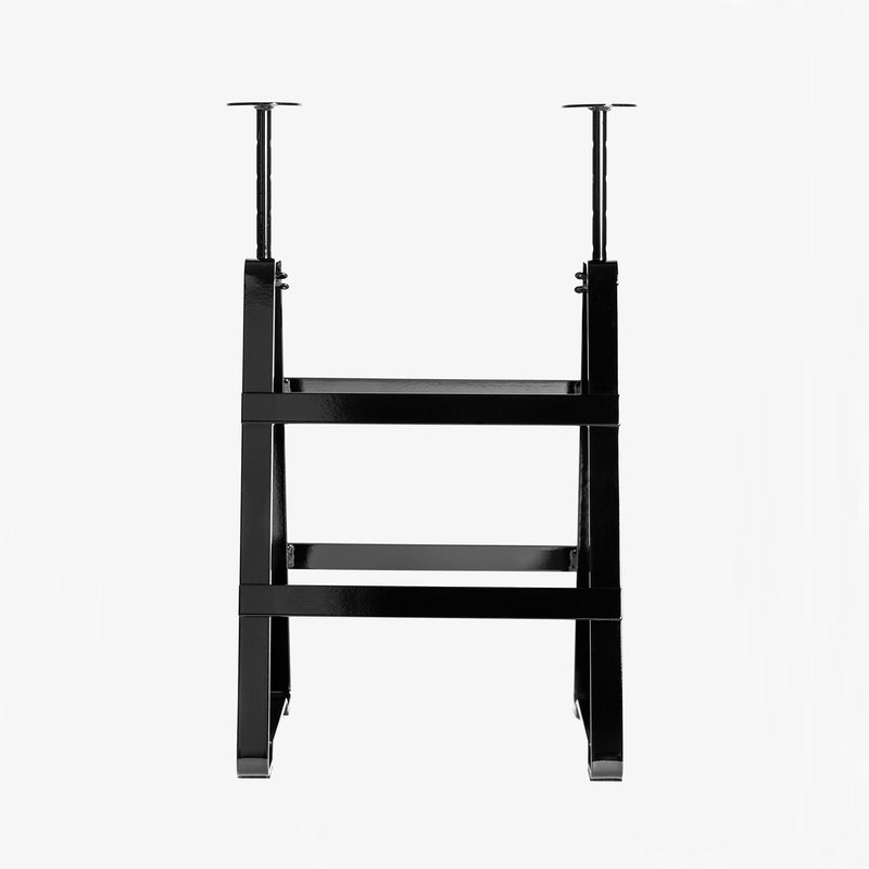 The Lackaffe Trestle by Atelier Haussmann is a black, adjustable desk frame made from powder-coated steel with vertical legs and horizontal supports for smooth height adjustment. Its sleek design echoes Berlin craft producers aesthetics, set against a plain white background.