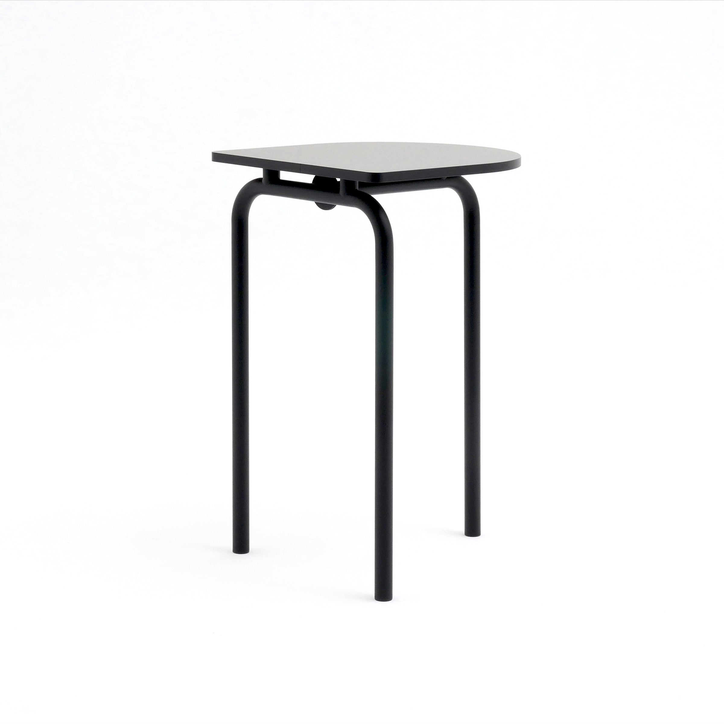 The Piombino Alto 700 by Atelier Haussmann is a minimalist black stool featuring a flat, slightly rounded square seat and three slender legs. Its industrial design complements the PIOMBINO table, set against a plain white background, perfect for any contemporary space.