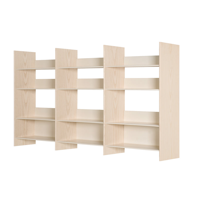 Three adjacent Bartmann Berlin Graph wooden bookshelves with a light beige finish create a uniform look. Each unit has four empty adjustable shelves, ready to become a compact floor-to-ceiling library.