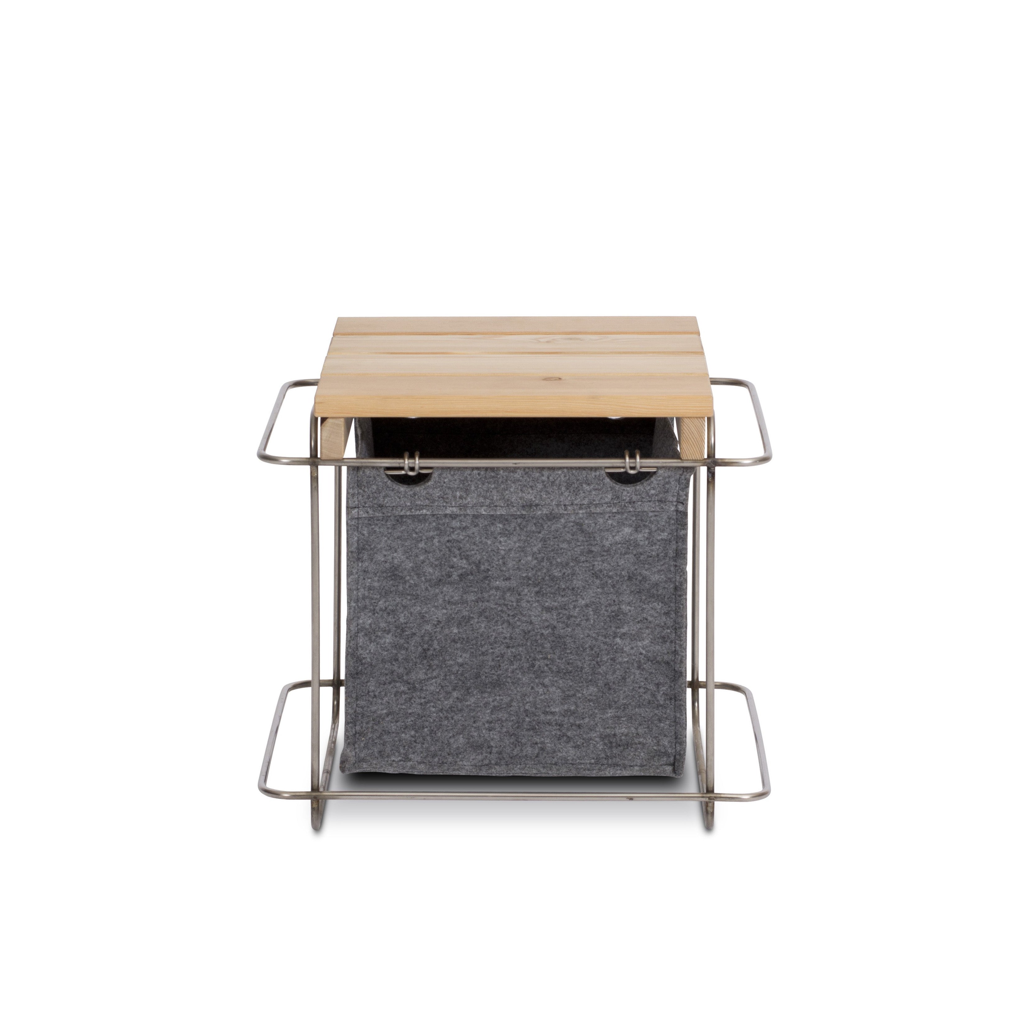 The Grit Stool Outdoor by Bartmann Berlin features a light wood top and grey PET felt fabric bin, complete with metal handles for easy transport and customizable storage options.
