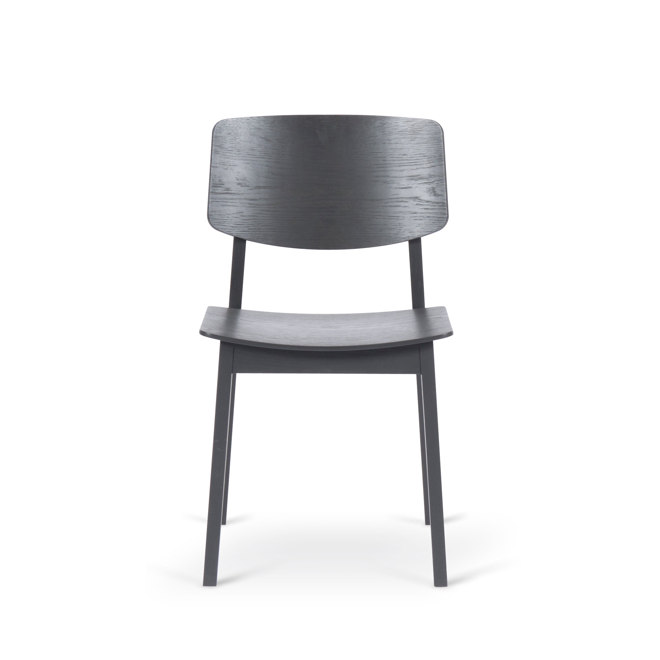 The Usus Chair by Bartmann Berlin combines natural elegance and modern minimalism with a simple dark gray wooden finish, curved backrest, and four sturdy legs, making it perfect for dining and office spaces.