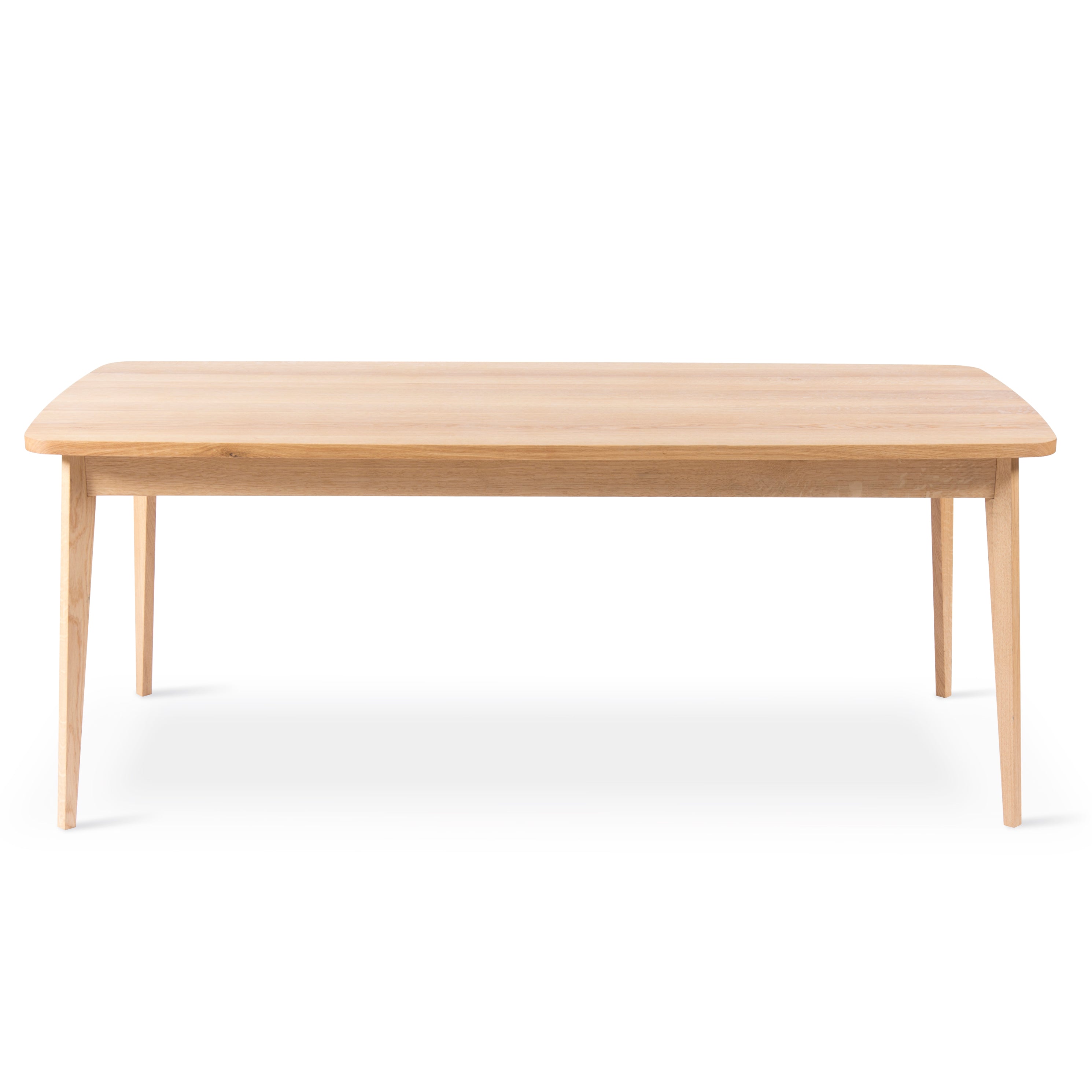 The Usus Table by Bartmann Berlin features a rectangular design with a smooth wooden surface and slender, tapered legs. Its European oak finish provides a light brown hue, highlighting its natural beauty against a plain white background.