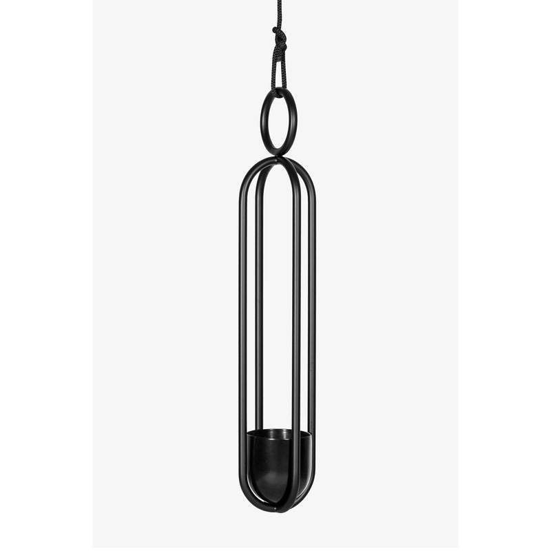 The Blumenampel - Hanging Flower Vase by Atelier Haussmann is a minimalist black metal piece with sleek, elongated vertical bars, a circular top loop, and a small flower holder. Suspended by a black cord, it adds sophistication to any space.