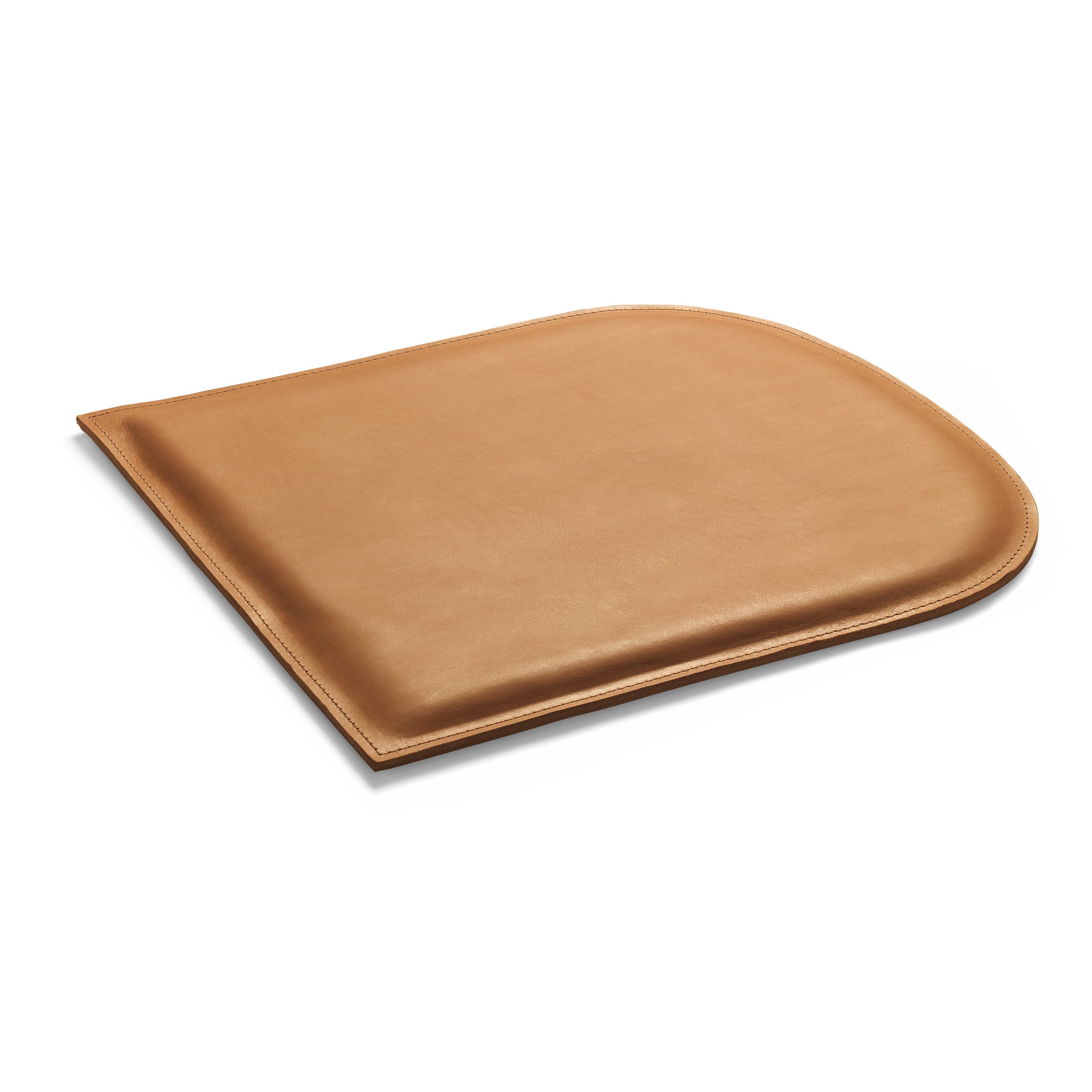 The CU10 GAMAR Cushion by E15, in brown harness leather with rounded edges and subtle stitching, lies on a white background. Its envelope style offers a smooth texture and minimalist design.